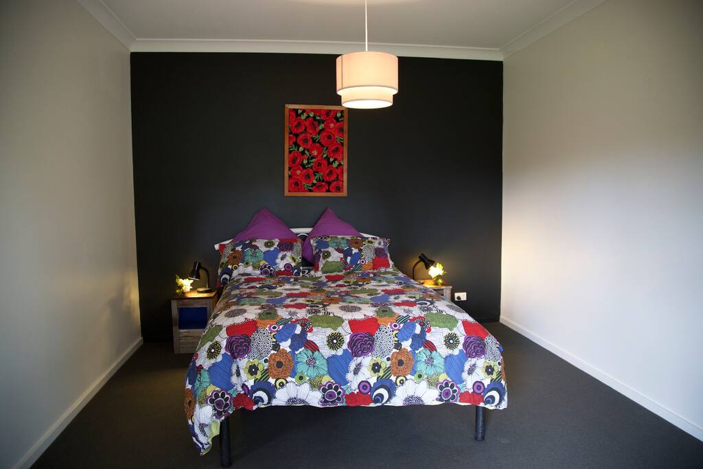 Private bedroom provided with sheets bedding, electric blanket and sliding door opening to veranda.