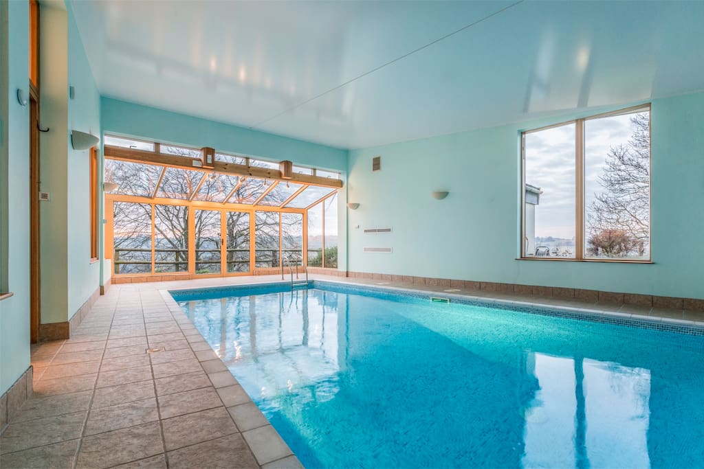 Indoor heated pool which can open up to the sunbathing area at the from with 6 sunbeds