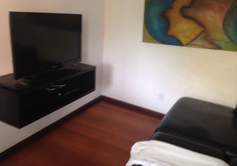 Sala de Tv com chaise long