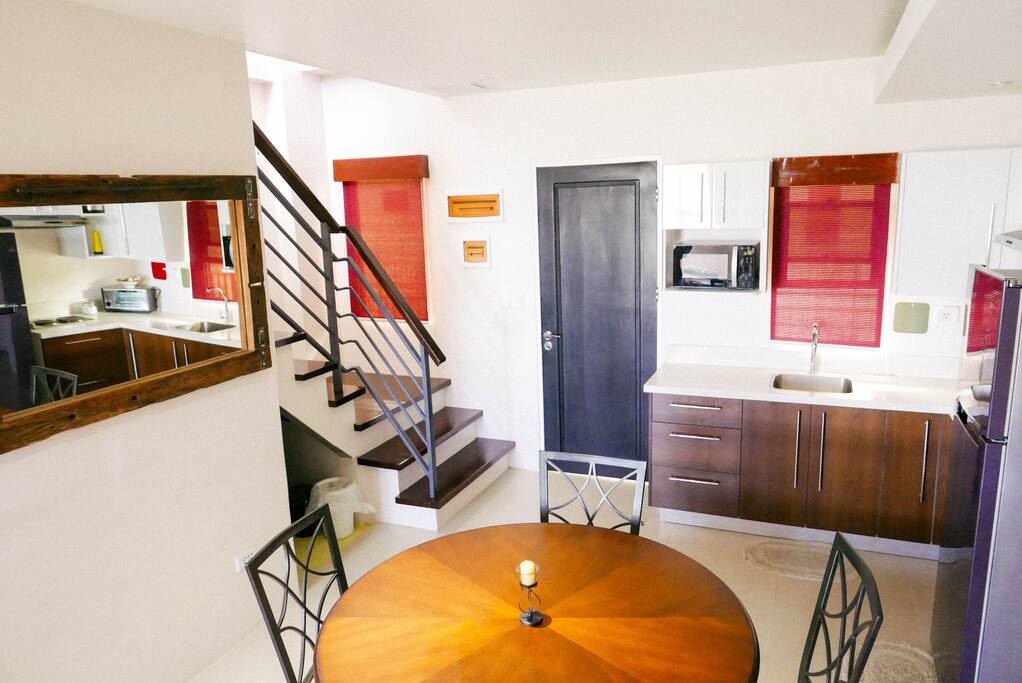 To the right of the entry way is a flight of stairs going up to the Loft Area and Bedrooms 1 & 2.