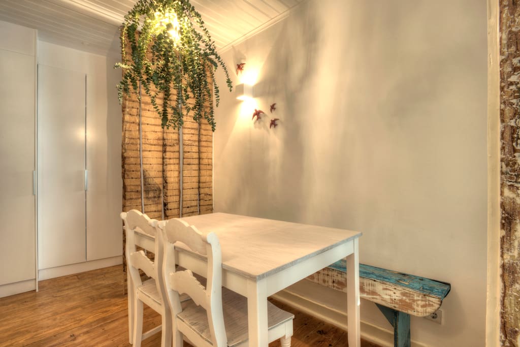 This is the Dining Room with a wooden bench and...