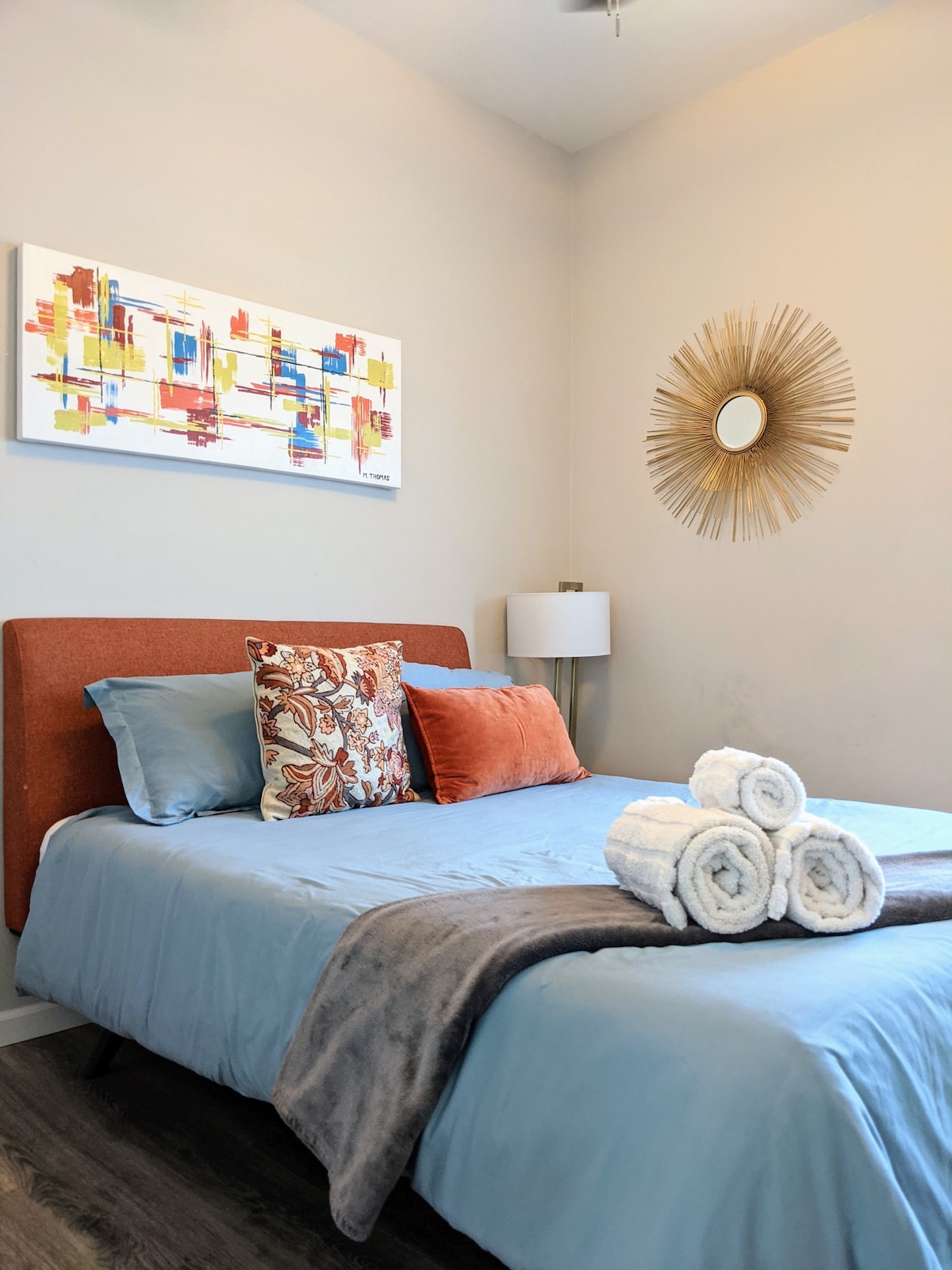 Wake up with the sun and cuddle up to a cup of coffee on our cooling gel queen mattress in this cozy bedroom!