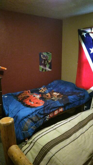 Twin bed beside the queen size bed