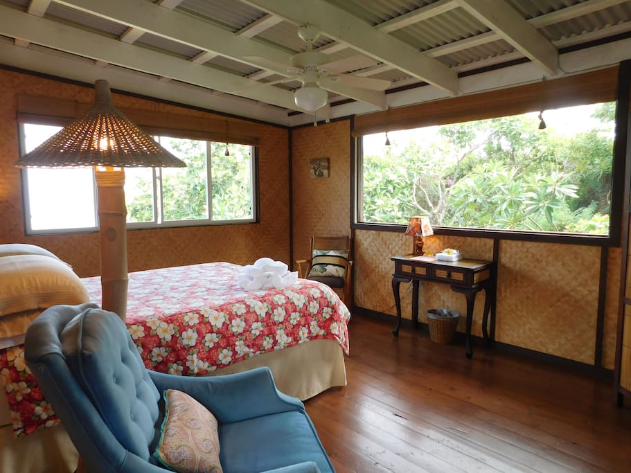 A spacious 11ft by 15ft room with garden and ocean views.