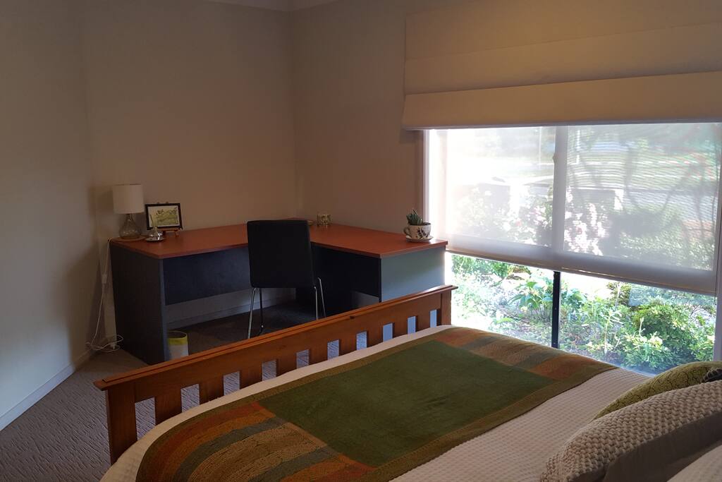 Main Bedroom includes a large desk with chair and views across to the Franklin Pond.