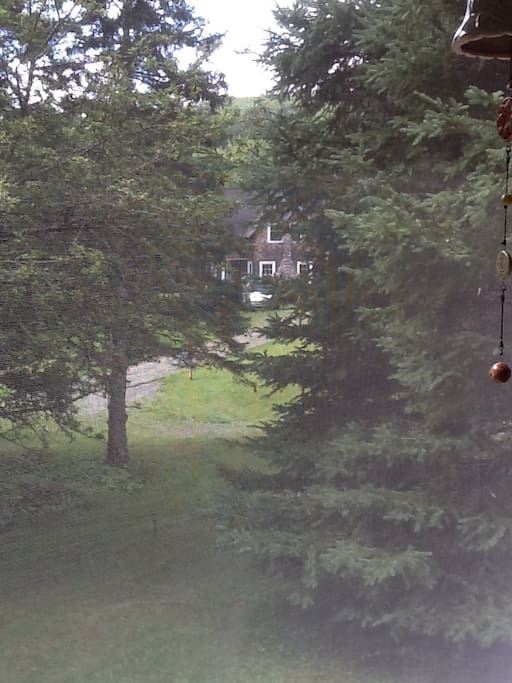 Walking down to parking area with view of our home.