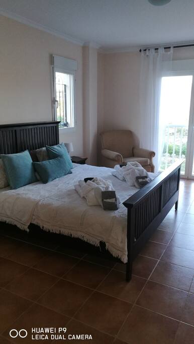 Super King Size bed looking over the lake