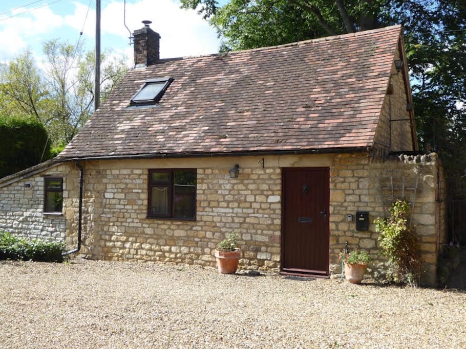 Front of cottage and parking space