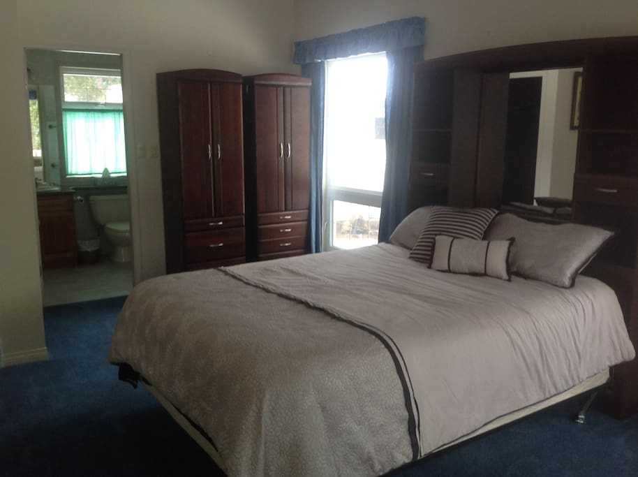 Bedroom 4 on the main level, full bathroom with tub/shower, walk in closet and private patio door to your own deck area.