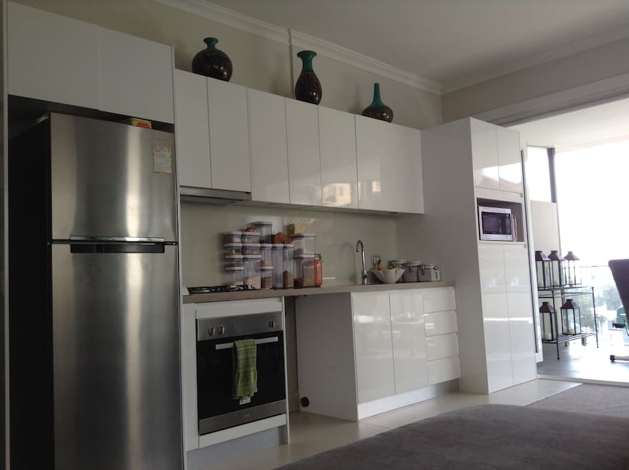 Kitchen that opens up to the ocean view balcony