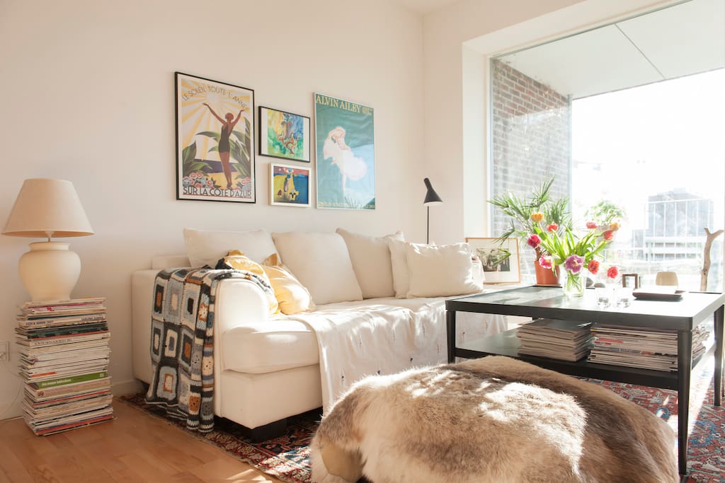 The living room and a peak to the balcony