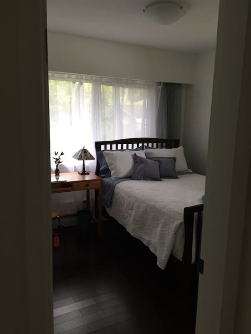 Second bedroom is bright and south facing with a double bed, desk and ample closet space.