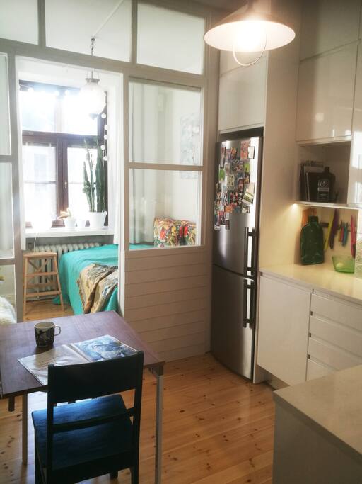 When you turn left from the hall you can see the modern and newly renovated kitchen and the cozy bedroom. Wooden floor and light fills the room.
