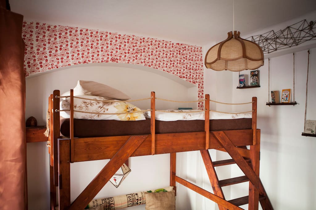 Wooden loft bed with comfortable stairs