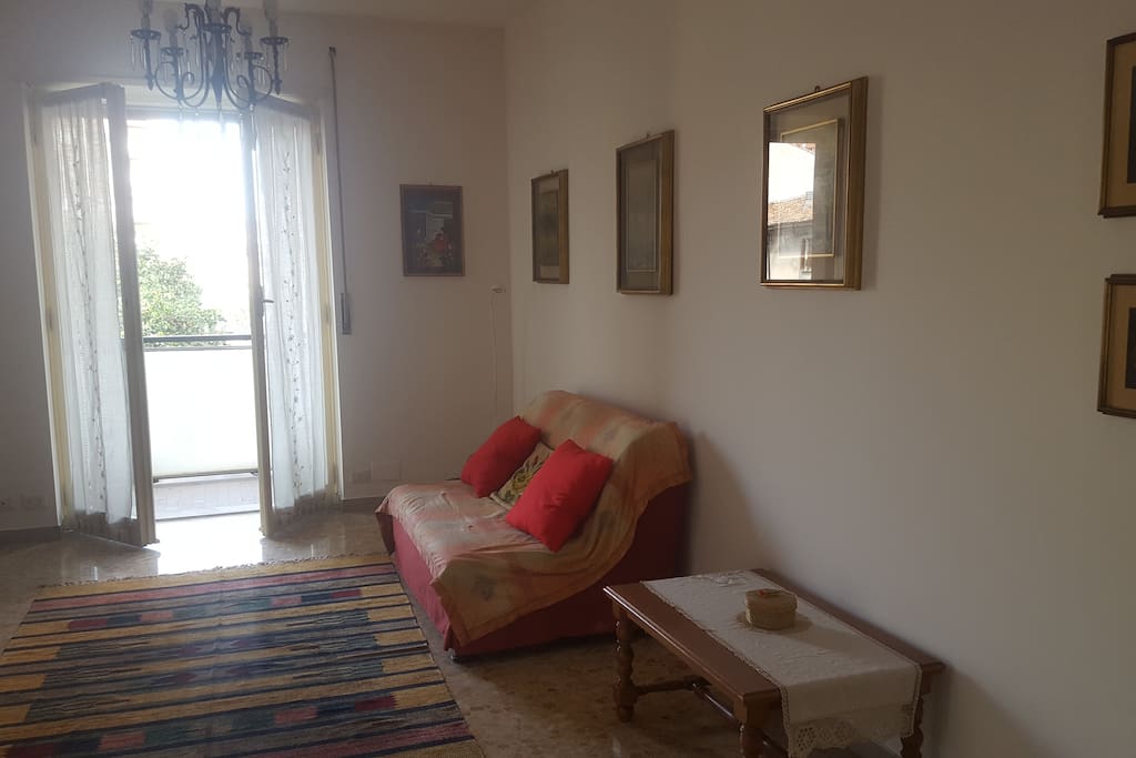 Living room with sofa bed and access to balcony