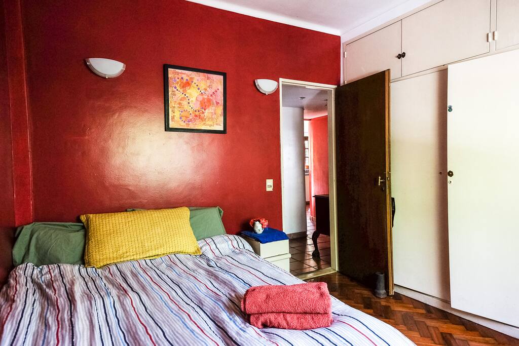 Big double bed and closet space for you to unpack.
