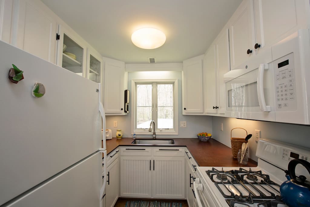 Kitchen complete with pots, pans, dishes, whatever you need.