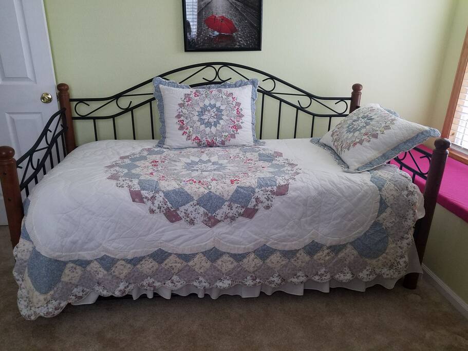 Second bedroom with a trundle bed under.