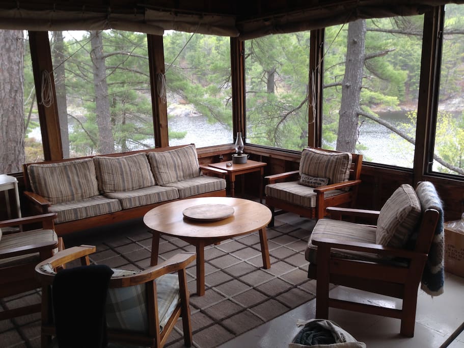 Screened-in porch with a view of the water - main cottage.