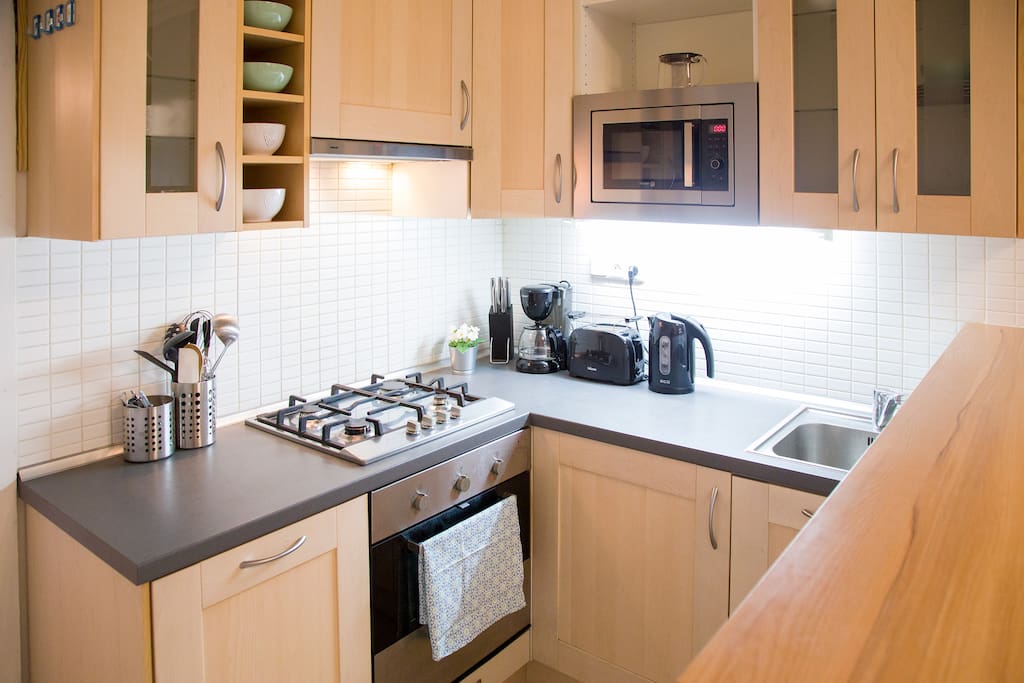 Fully-equiped kitchen, dishwasher, oven, stove, microwave oven, kettle, coffee maker, toaster...