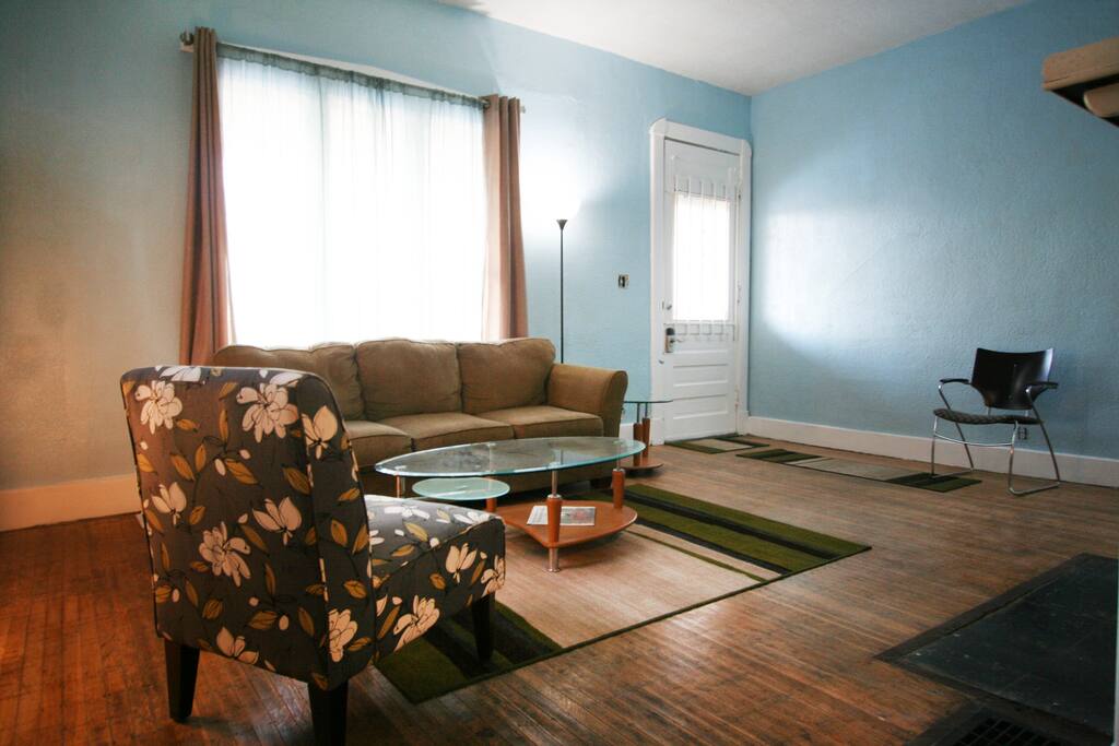 Large windows bring in ample daylight from the north-facing brick porch.