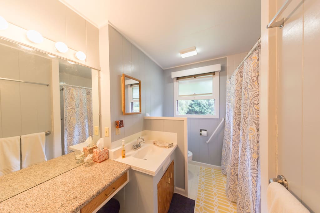 This is the guest bathroom. There is a big vanity and large shower. The sink drains slow, so there is a mirror in the shower for shaving. The hot water to the sink is also very slow. The shower and toilet work great!
