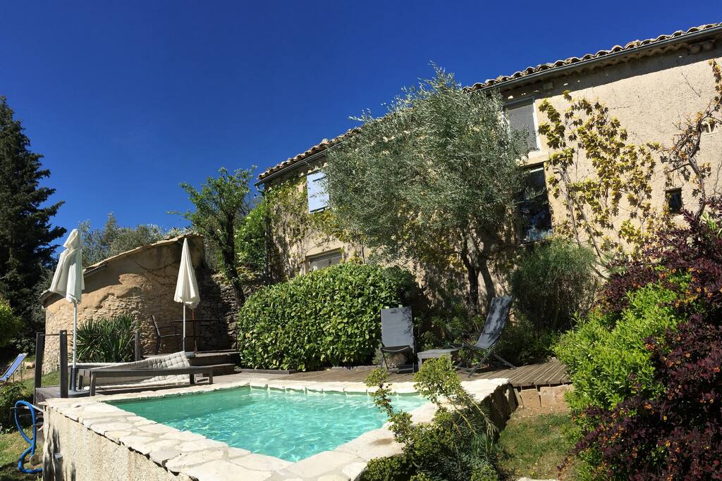The private plunge pool, with decking and sun/shade seating, is adjacent to the cottage