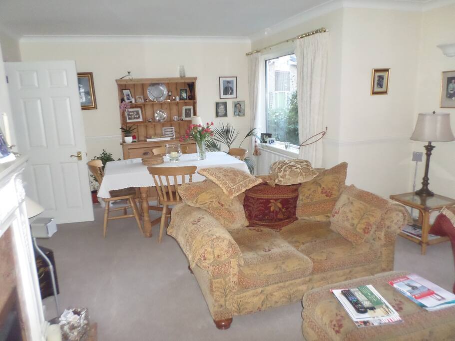 Bright sunny lounge/dining room where breakfast is served