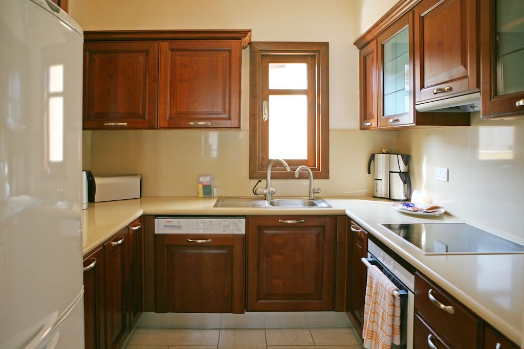Make a delicious meal in the kitchen with a variety of appliances including a dish washer.