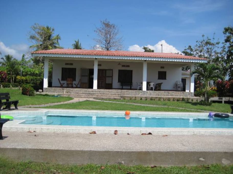view of house and pool from beach