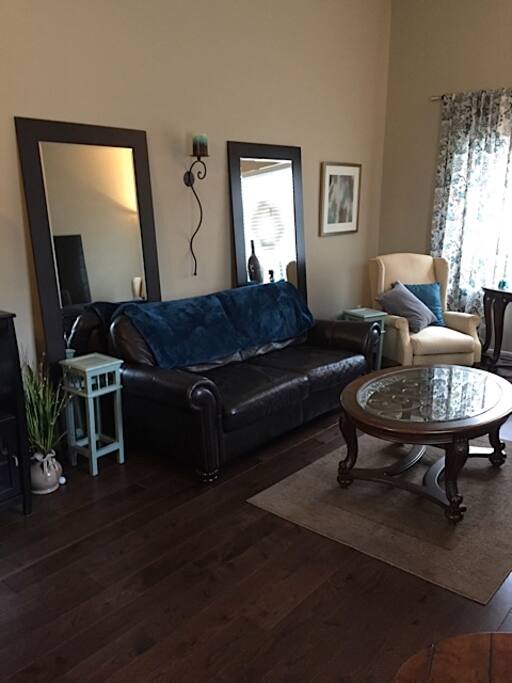 Living room with leather couch and chairs.