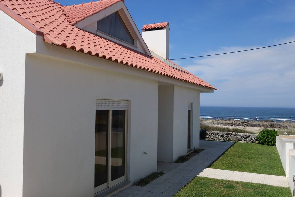 Window's house on the rocks of Moledo beach