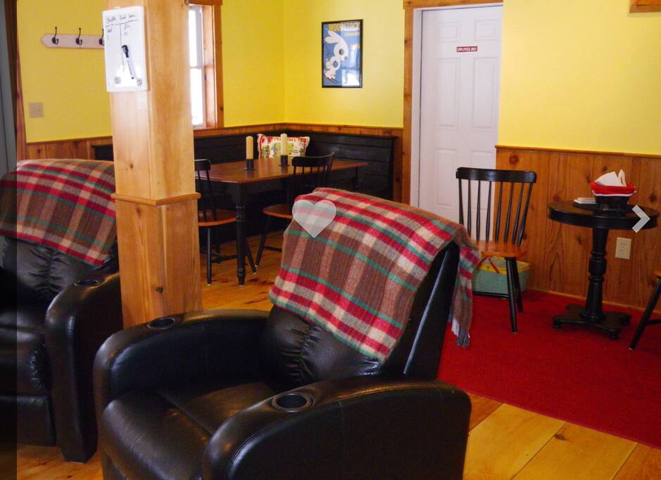 Living room- shuffleboard table, dining table, new couch added