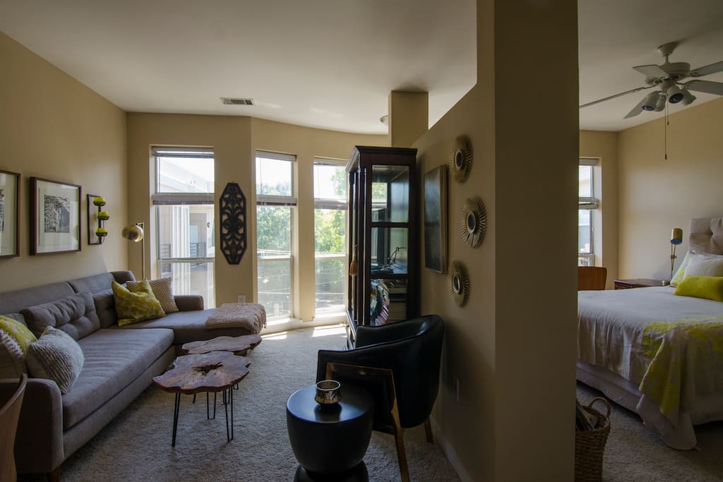 Seven floor to ceiling windows bathe this top floor apartment in natural light!