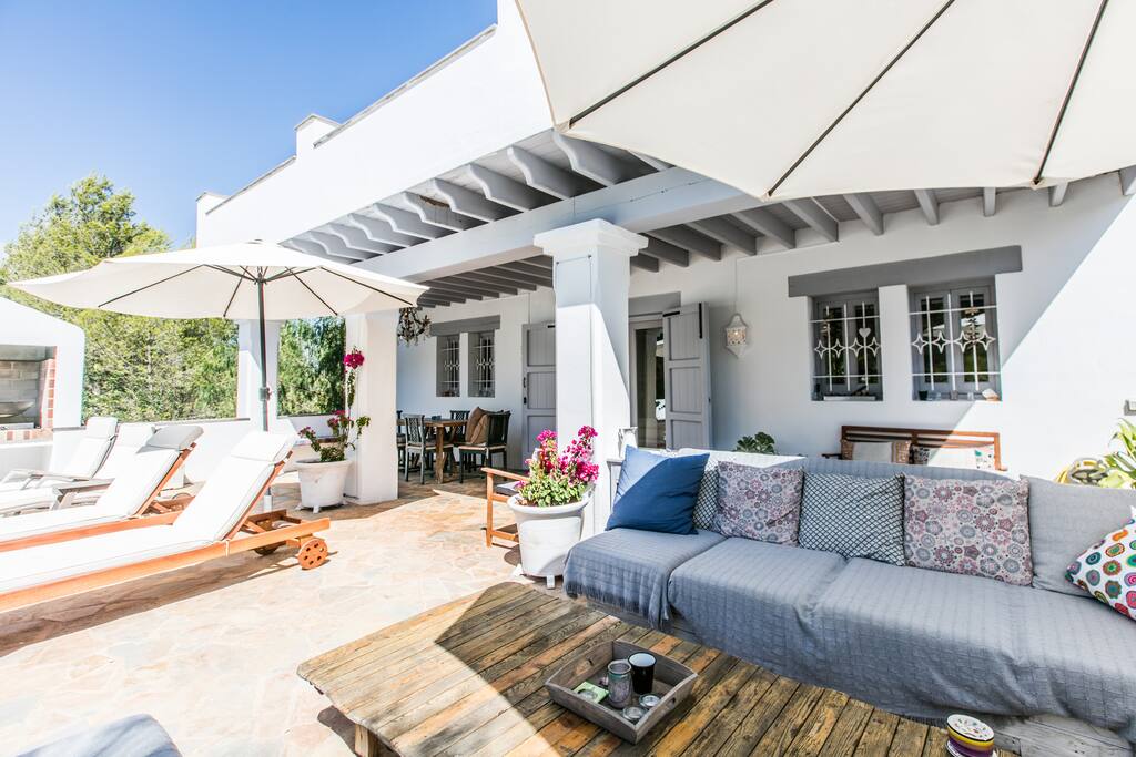 Pool terrace with sunloungers and more chill out area