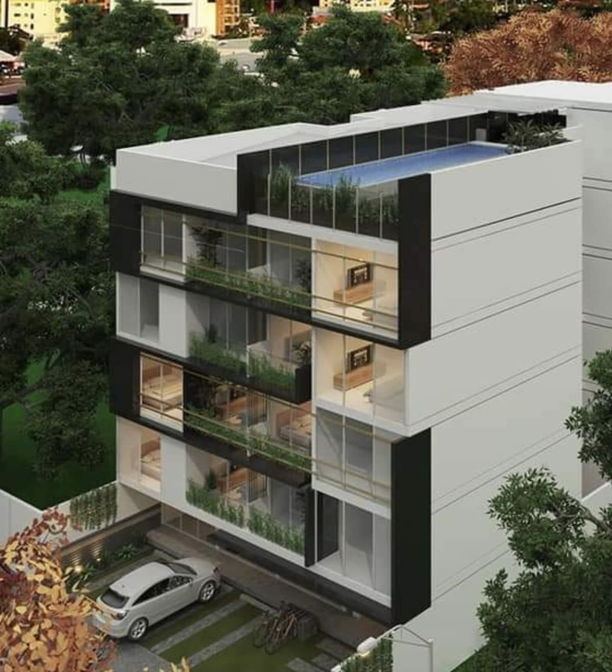 The modern condominium features a sleek architectural design with multiple levels and large glass windows. A terrace pool can be seen at the top, surrounded by greenery. The entrance includes a parking area, with bicycles parked nearby, emphasizing accessibility.