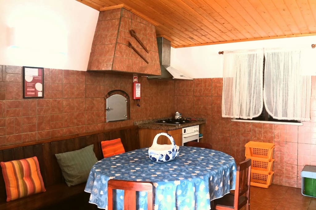 Typical kitchen with wood oven and gas oven