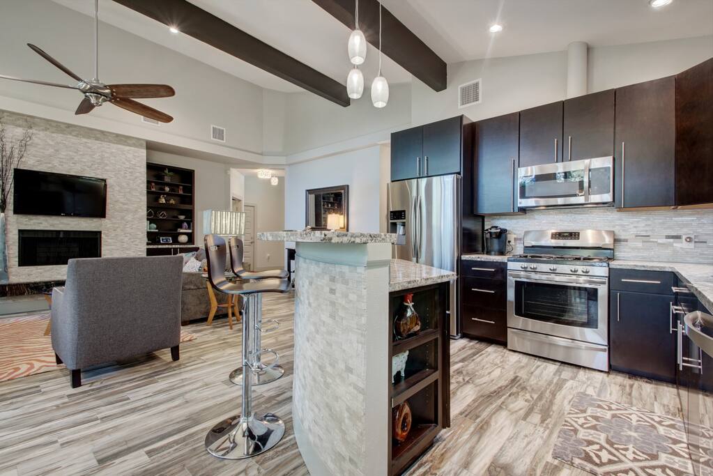 This luxury kitchen opens up to the living and dining room.