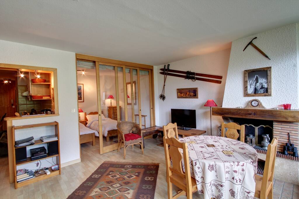 The lounge. The bedroom in the background is separated by glass sliding doors and a light-proof curtain.