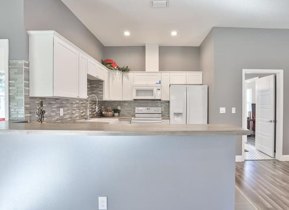The kitchen with another available shared bathroom.