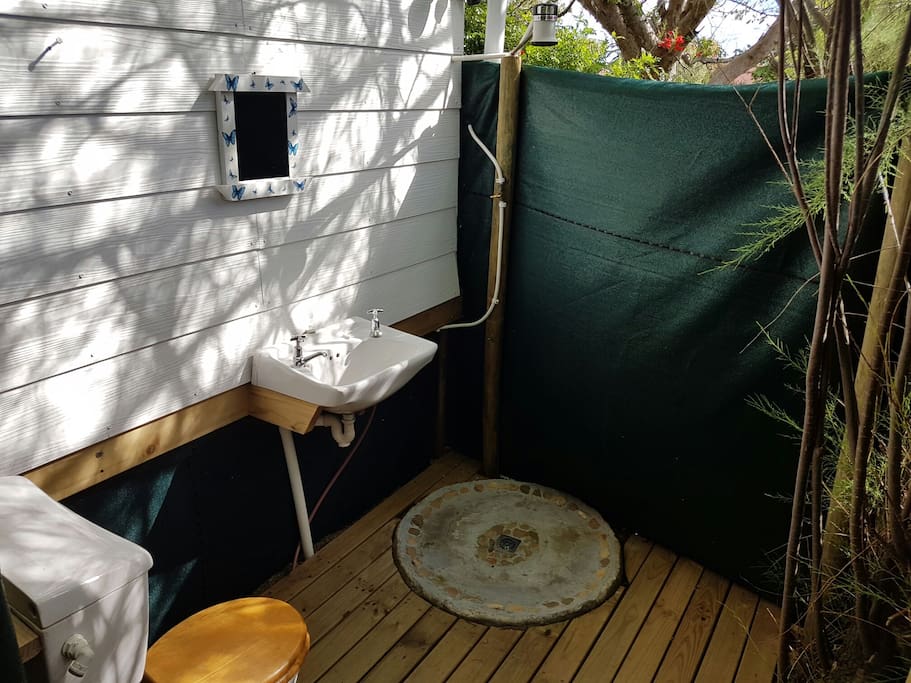 Private bathroom with open hot shower
