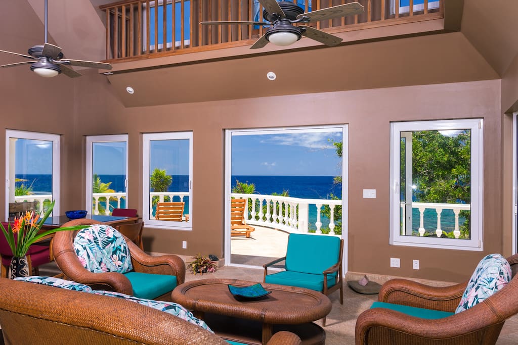 Walls of glass allows you to enjoy sea views from the living room