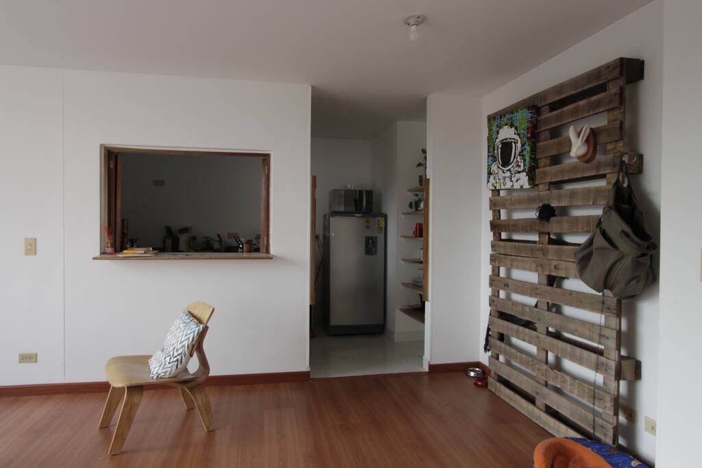 Open living room for use and open kitchen .
