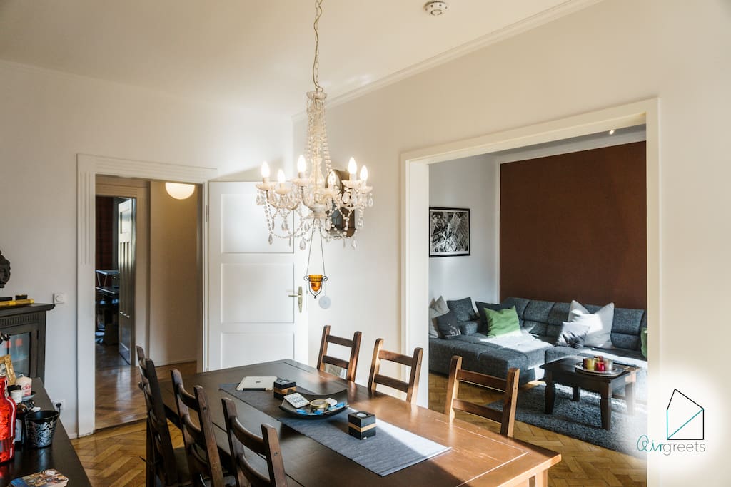 The dining area offers a wooden table and plenty of room to relax.
