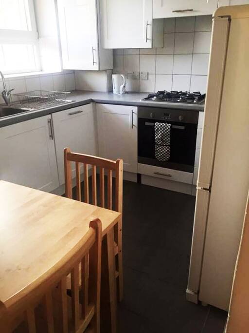 Eat-in kitchen with full appliances