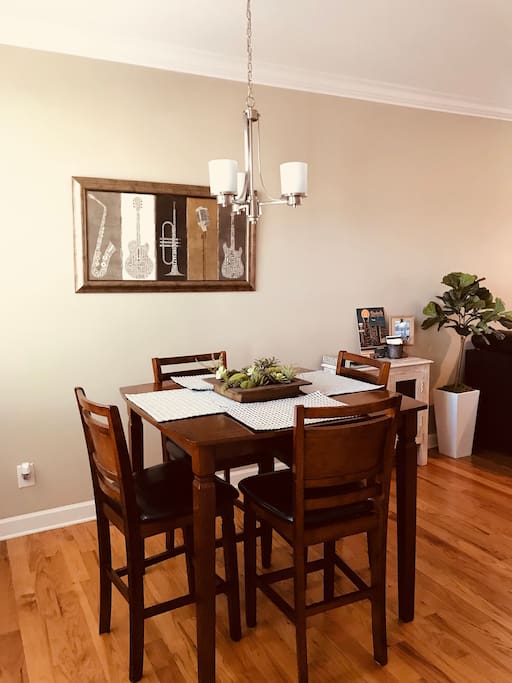 This dining area allows you to keep up with activity in the living room and the kitchen