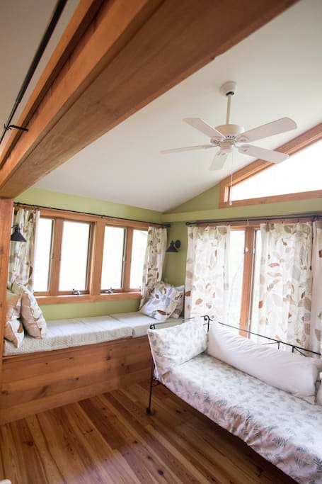 Cozy reading nook to relax by the windows. Also a Day Bed for day:night use.