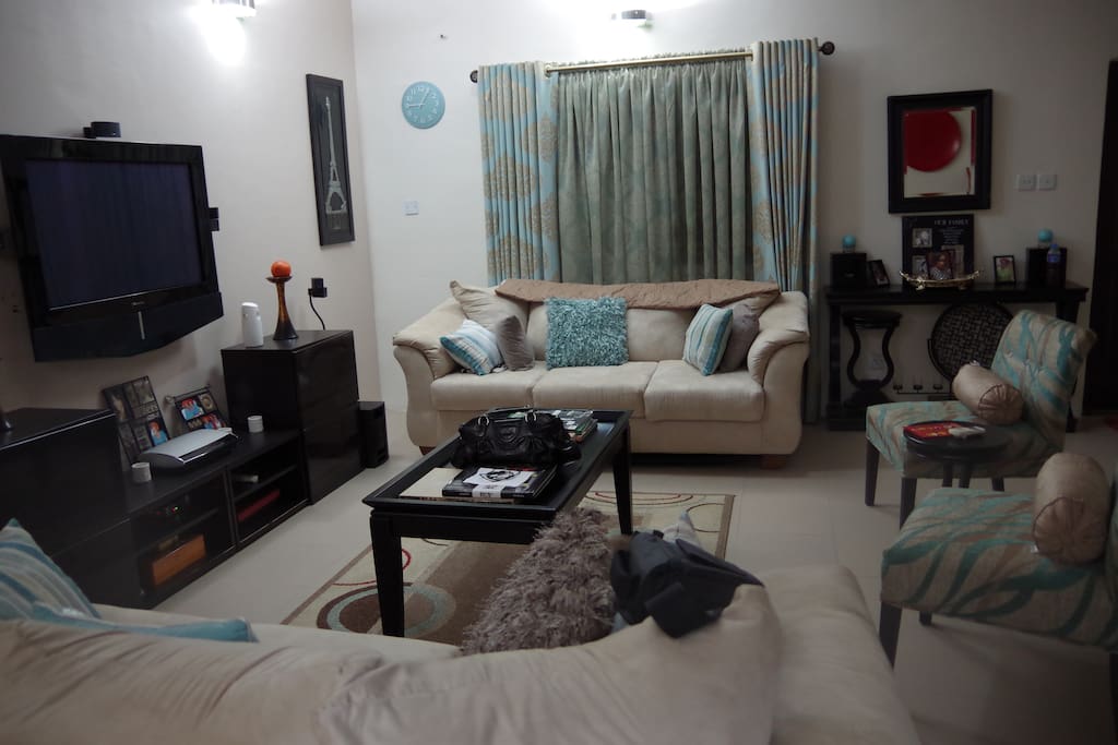 Lovingly decorated living room with 42 inch tv and Bose surround sound system for guest to relax after a long day.