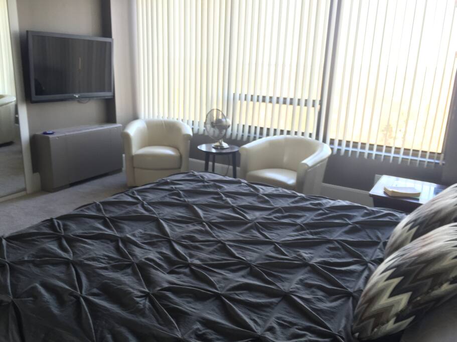 Master bedroom with King bed and TV.