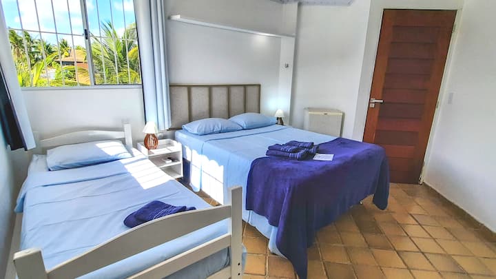 Suite 2 -  1 double bed, 1 single bed, bathroom, minibar, TV and air conditioning.
